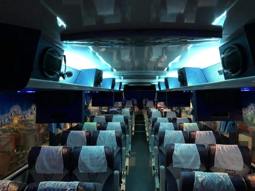 The interior of a Skylight Buslines coach, seats prepared and cabin lighting on